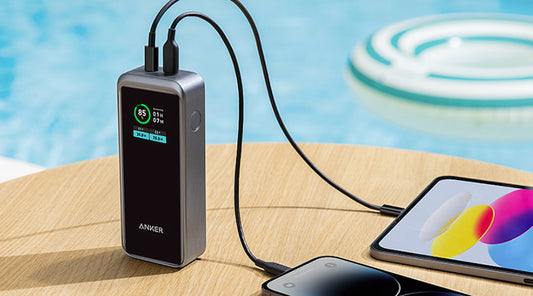 Anker power bank charging a phone and tablet