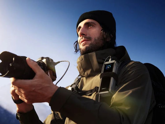 Outdoor photographer using Anker portable power bank
