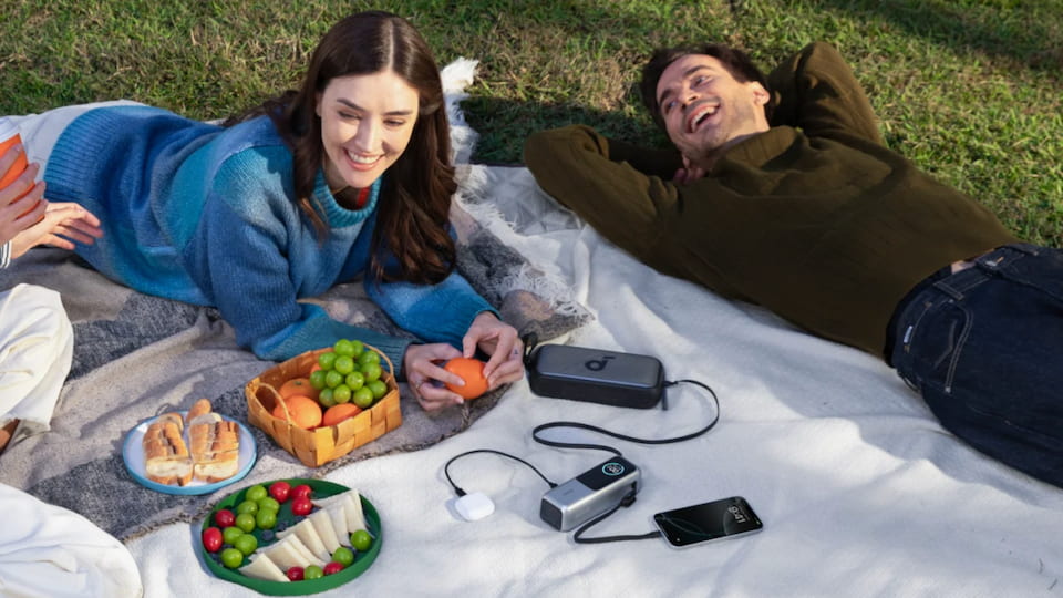 Using Anker power bank during picnic