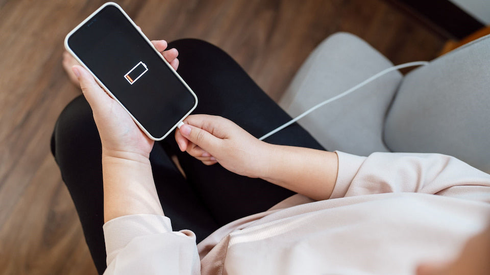 Plugging cable into phone charging port