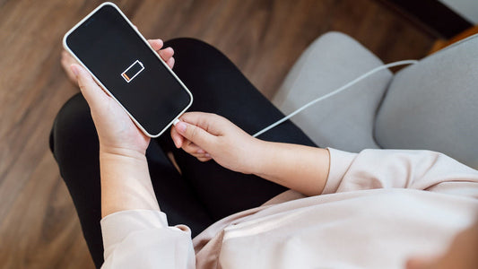 Plugging cable into phone charging port
